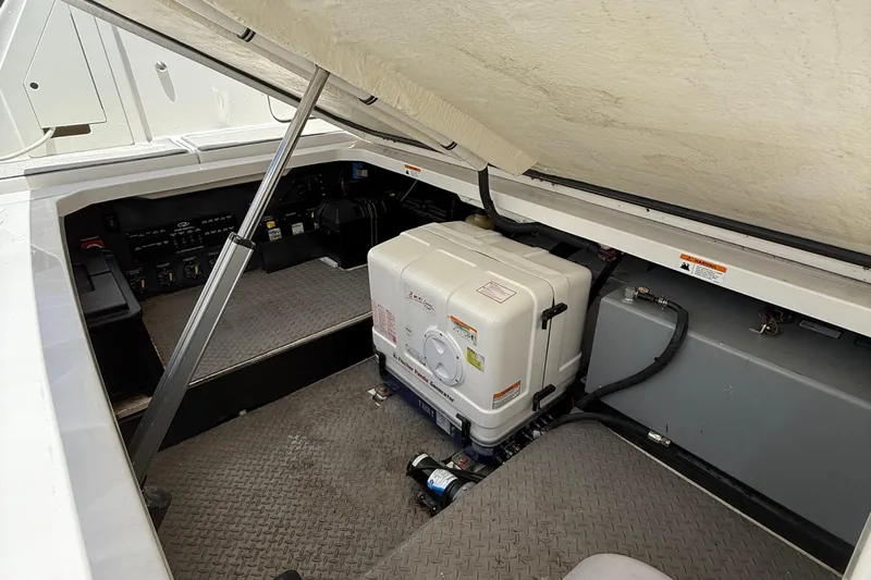  Yacht Photos Pics 2022 Regal 38 SAV boat engine compartment with generator and control panel.