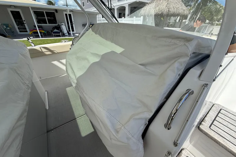  Yacht Photos Pics 2022 Regal 38 SAV boat interior with covered seating area.