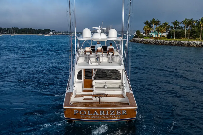 South Jersey Yacht Sales Demo Boat Yacht Photos Pics 2025 Viking 64 Convertible yacht "Polarizer" on the water, rear view.