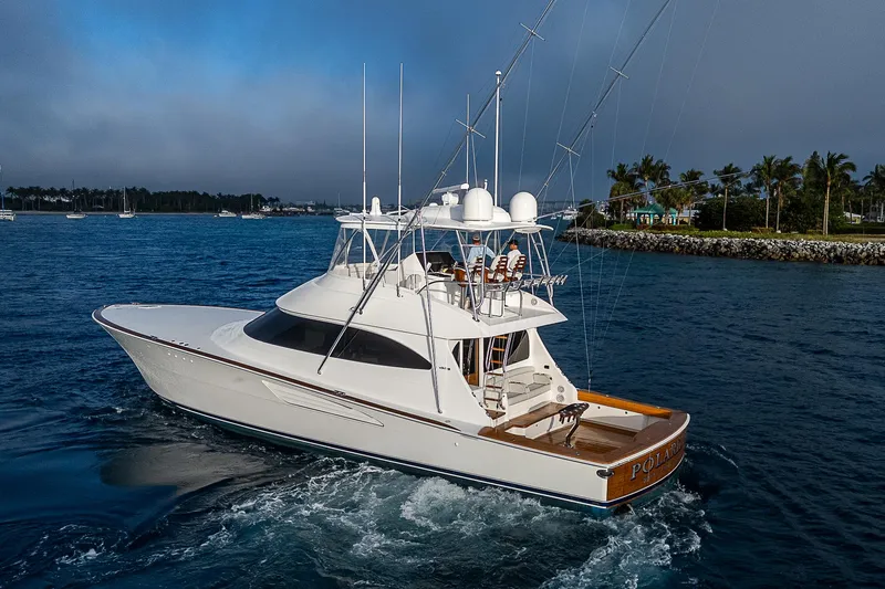 South Jersey Yacht Sales Demo Boat Yacht Photos Pics 2025 Viking 64 Convertible yacht cruising on a serene blue ocean.