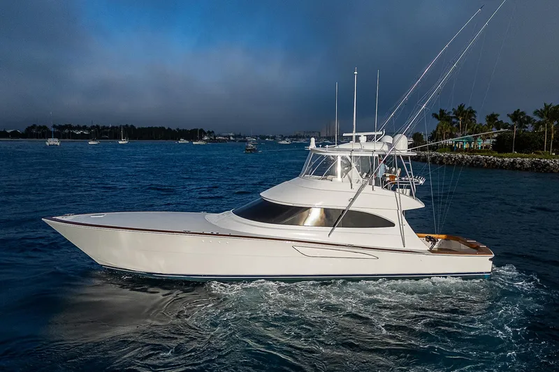 South Jersey Yacht Sales Demo Boat Yacht Photos Pics 2025 Viking 64 Convertible yacht cruising on a serene blue ocean.