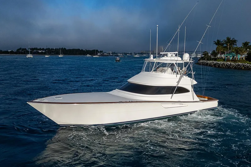 South Jersey Yacht Sales Demo Boat Yacht Photos Pics 2025 Viking 64 Convertible yacht cruising on a serene blue ocean.