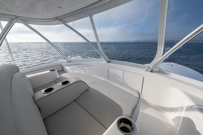 South Jersey Yacht Sales Demo Boat Yacht Photos Pics Luxurious interior of 2025 Viking 64 Convertible yacht with ocean view.