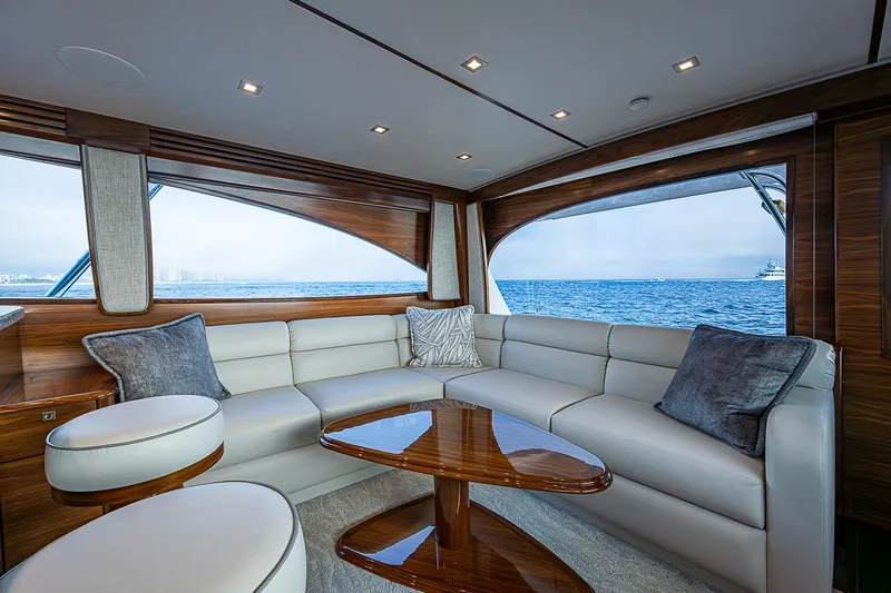 South Jersey Yacht Sales Demo Boat Yacht Photos Pics Luxurious interior of 2025 Viking 64 Convertible yacht with ocean view.