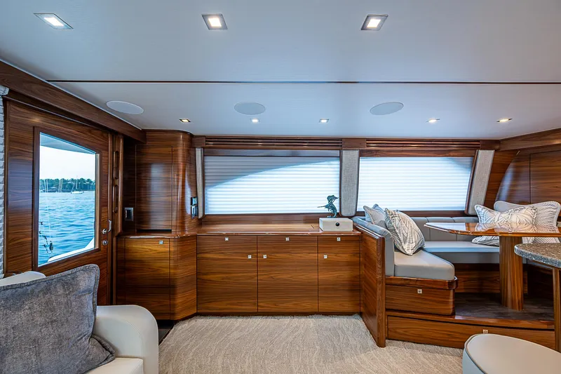 South Jersey Yacht Sales Demo Boat Yacht Photos Pics Luxurious interior of 2025 Viking 64 Convertible yacht with elegant wood finishes.