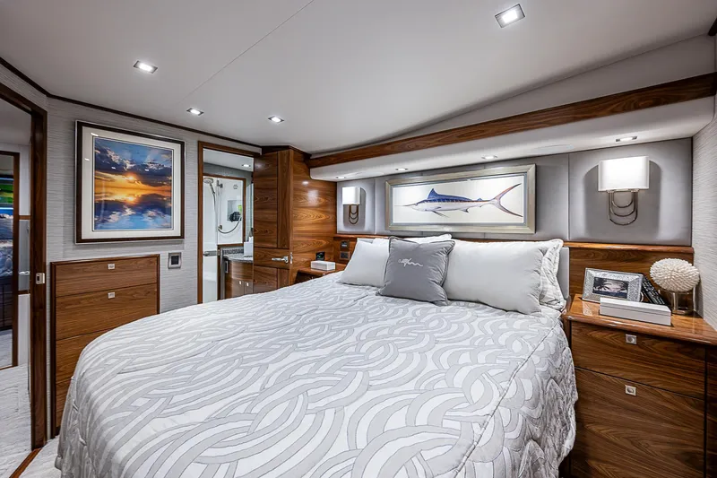 South Jersey Yacht Sales Demo Boat Yacht Photos Pics Luxurious bedroom interior of 2025 Viking 64 Convertible yacht with modern decor and ambient lighting.