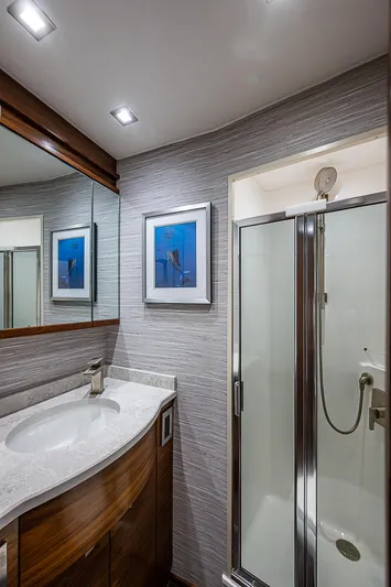 South Jersey Yacht Sales Demo Boat Yacht Photos Pics Luxurious bathroom in 2025 Viking 64 Convertible yacht with modern shower and vanity.