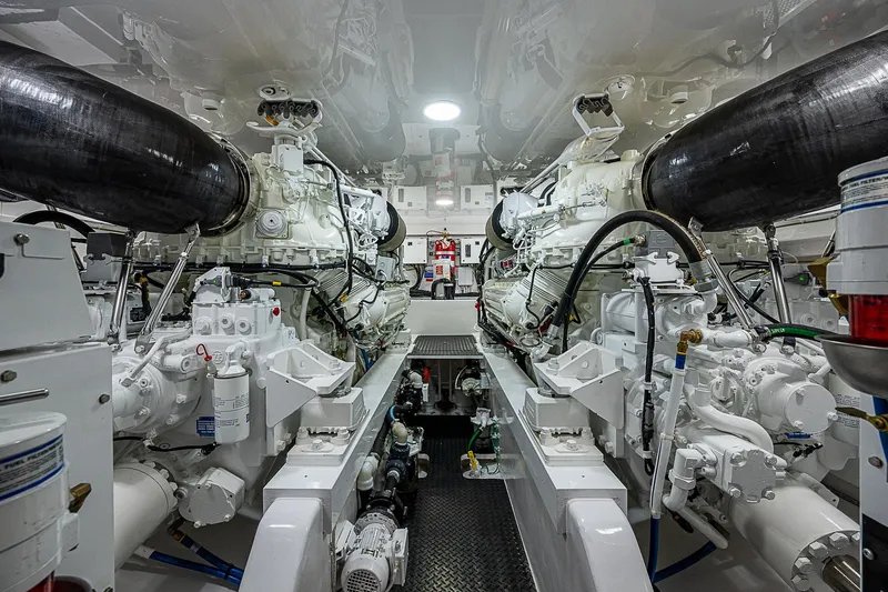 South Jersey Yacht Sales Demo Boat Yacht Photos Pics Engine room of 2025 Viking 64 Convertible yacht, showcasing advanced machinery and equipment.