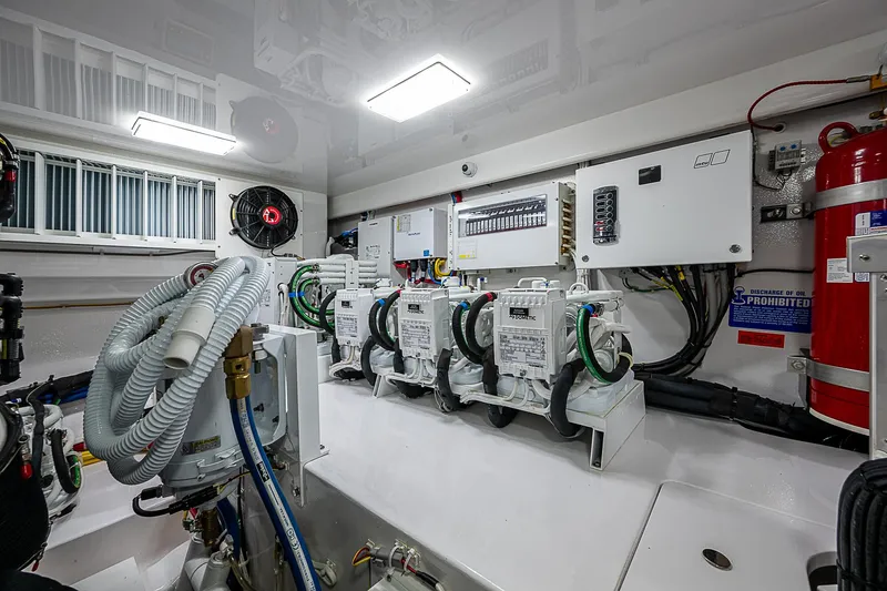 South Jersey Yacht Sales Demo Boat Yacht Photos Pics Engine room of 2025 Viking 64 Convertible yacht, showcasing advanced electrical systems.