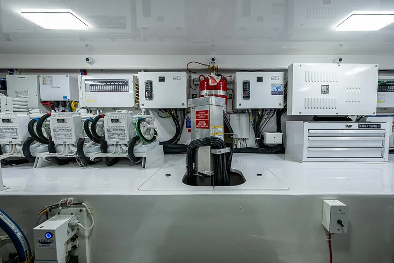 South Jersey Yacht Sales Demo Boat Yacht Photos Pics Engine room of 2025 Viking 64 Convertible yacht with advanced electrical systems.