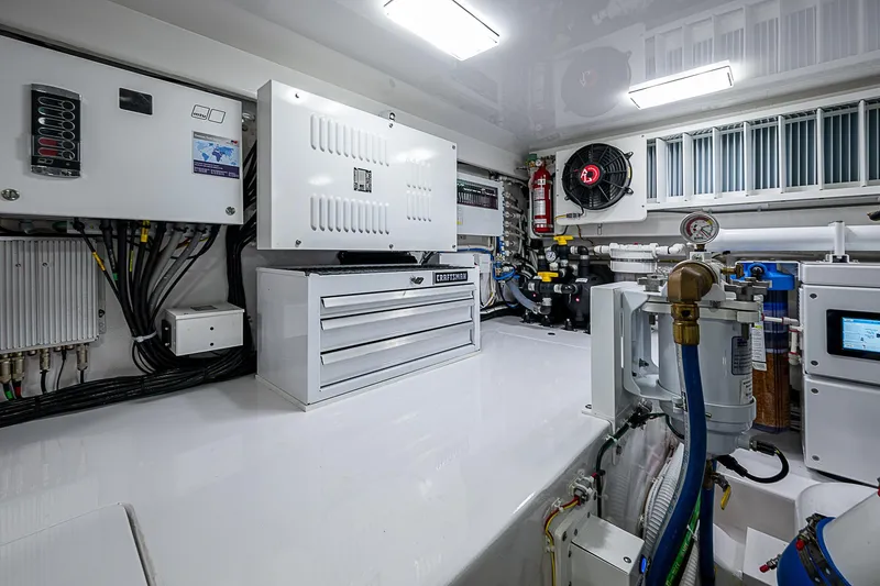 South Jersey Yacht Sales Demo Boat Yacht Photos Pics Engine room of 2025 Viking 64 Convertible yacht, featuring modern equipment and storage.