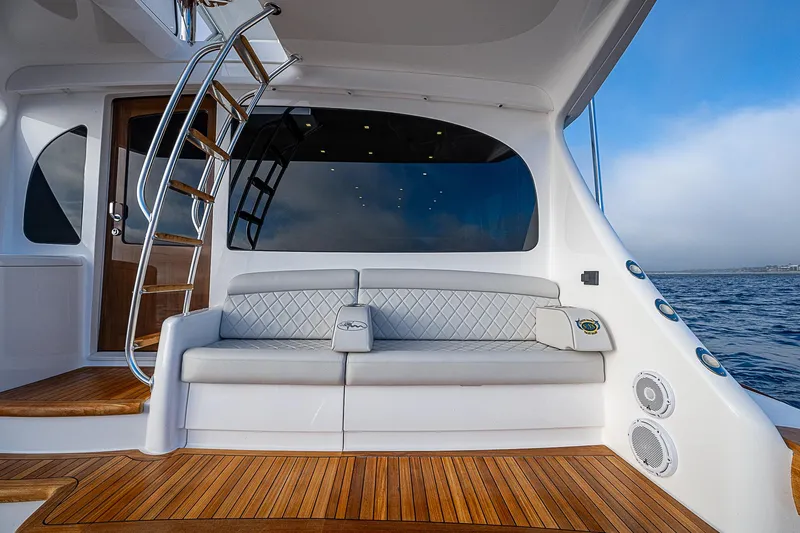 South Jersey Yacht Sales Demo Boat Yacht Photos Pics 2025 Viking 64 Convertible yacht with elegant seating and ocean view.