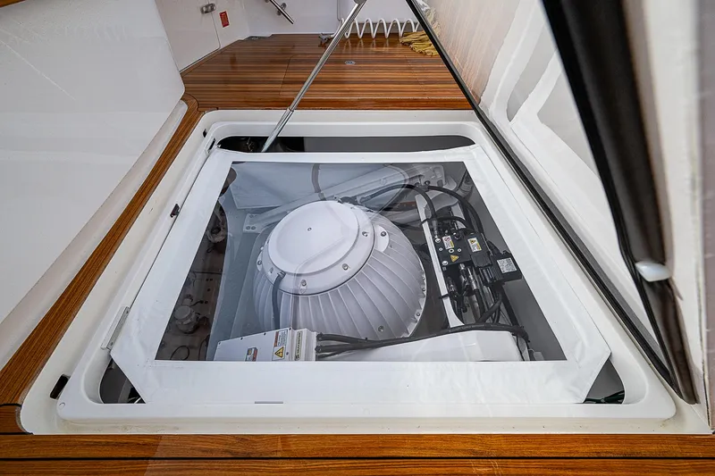 South Jersey Yacht Sales Demo Boat Yacht Photos Pics 2025 Viking 64 Convertible engine compartment with advanced machinery and sleek design.