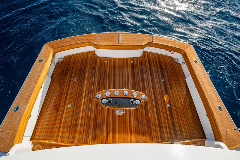 South Jersey Yacht Sales Demo Boat Yacht Photos Pics Viking 64 Convertible 2025 yacht deck with polished wood finish, overlooking ocean.