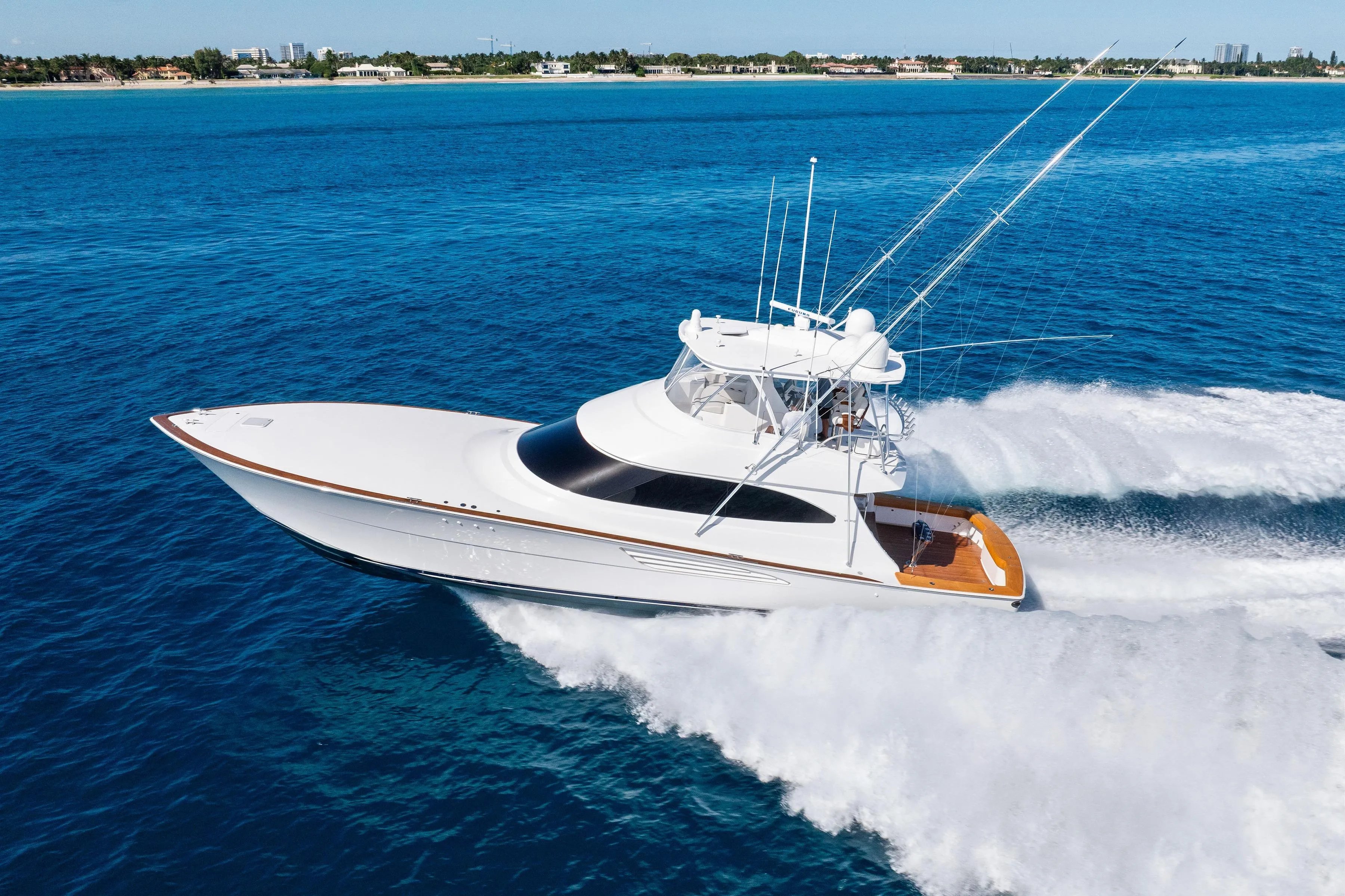 2025 Viking 64 Convertible yacht cruising on open blue ocean waters.