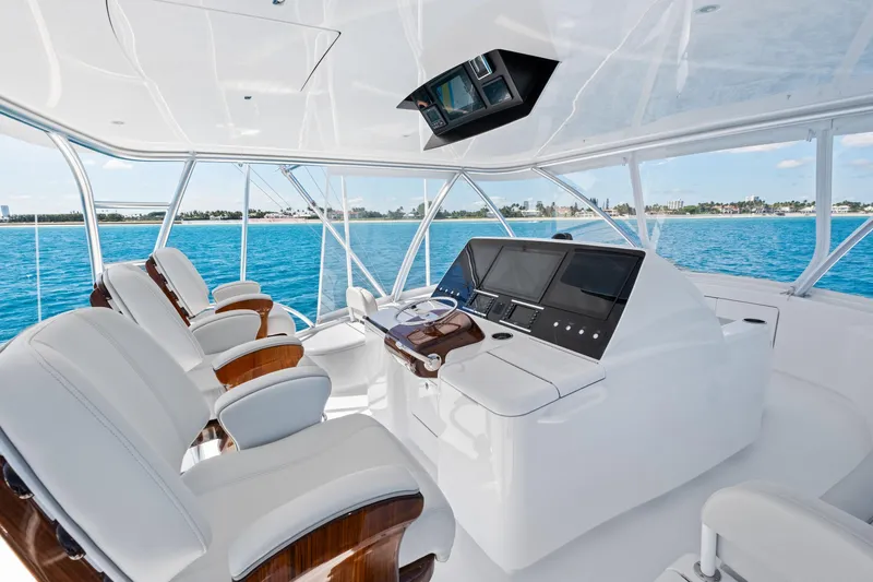  Yacht Photos Pics 2025 Viking 64 Convertible yacht helm with luxurious seating and advanced navigation systems.