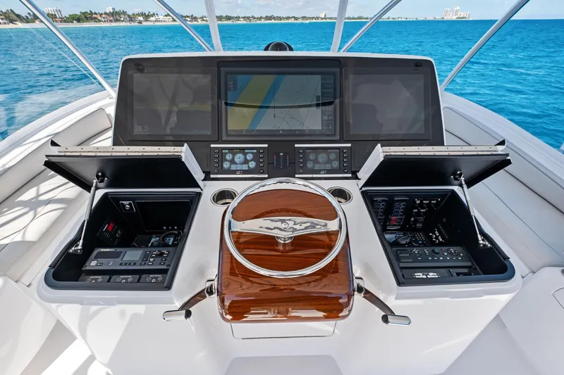  Yacht Photos Pics 2025 Viking 64 Convertible yacht helm with advanced navigation displays and controls.