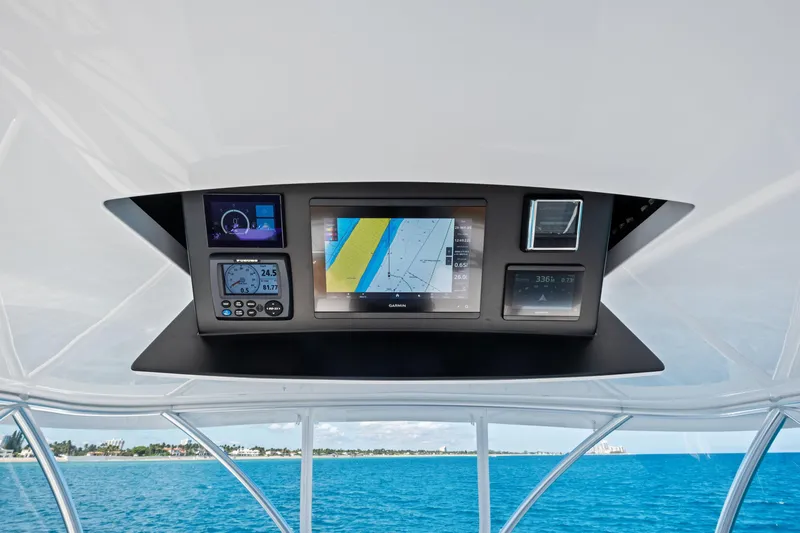  Yacht Photos Pics 2025 Viking 64 Convertible yacht navigation system with digital displays and ocean view.