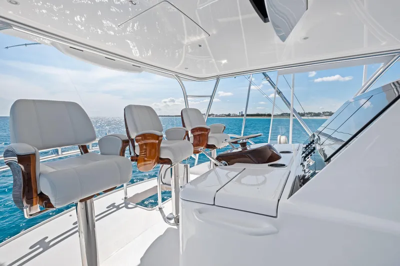  Yacht Photos Pics Luxurious helm of 2025 Viking 64 Convertible yacht with ocean view.