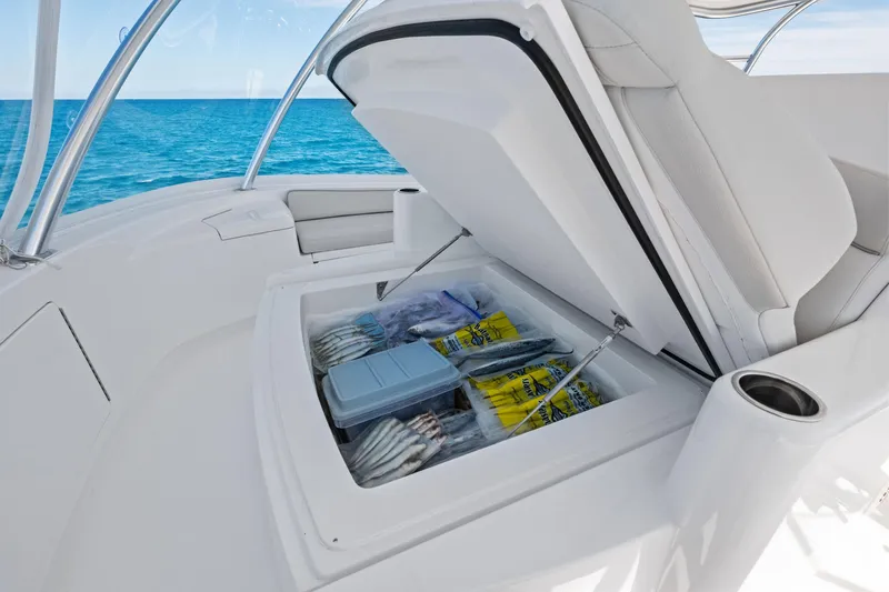  Yacht Photos Pics Open storage compartment on 2025 Viking 64 Convertible yacht, with ocean view.