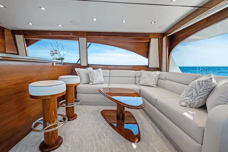 Yacht Photos Pics Luxurious interior of 2025 Viking 64 Convertible yacht with elegant seating and ocean view.