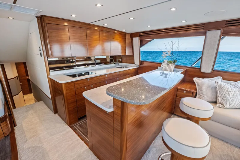  Yacht Photos Pics Luxurious interior of 2025 Viking 64 Convertible yacht with ocean view.