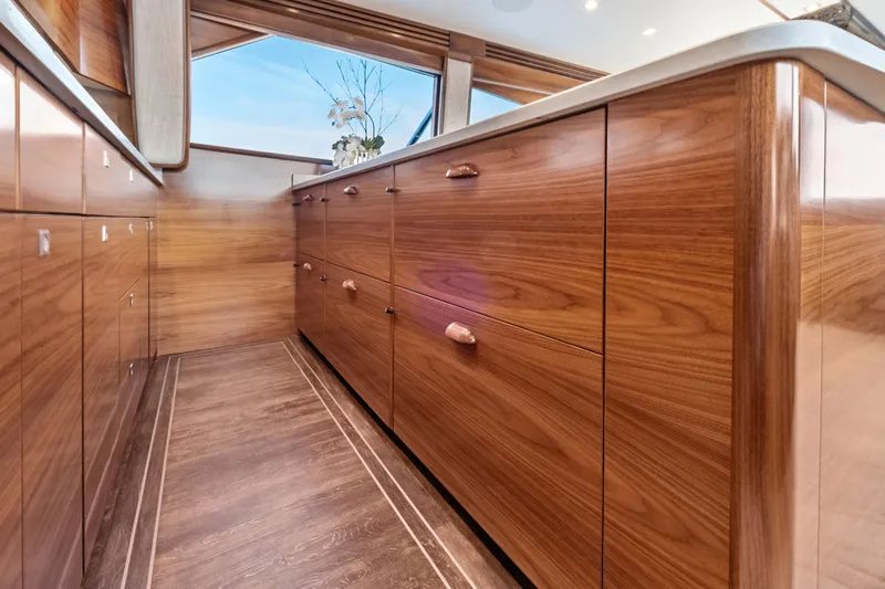  Yacht Photos Pics Luxurious wooden cabinetry inside the 2025 Viking 64 Convertible yacht.