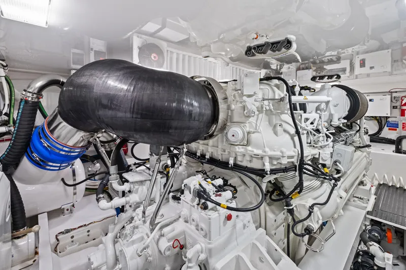  Yacht Photos Pics Engine room of 2025 Viking 64 Convertible yacht, showcasing advanced machinery and components.