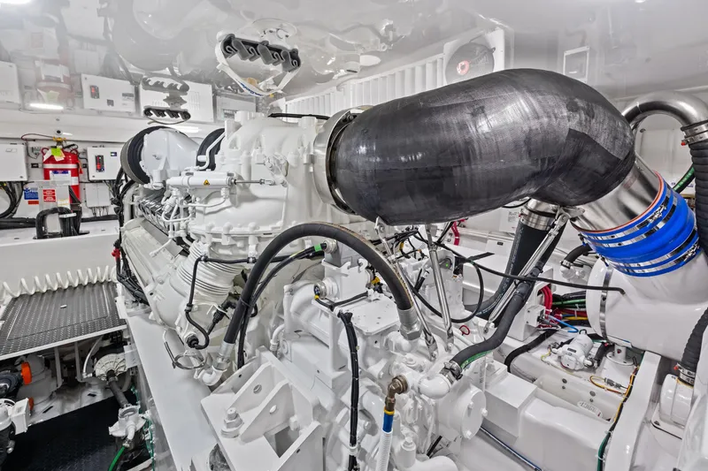  Yacht Photos Pics Engine room of 2025 Viking 64 Convertible yacht, showcasing advanced machinery and components.
