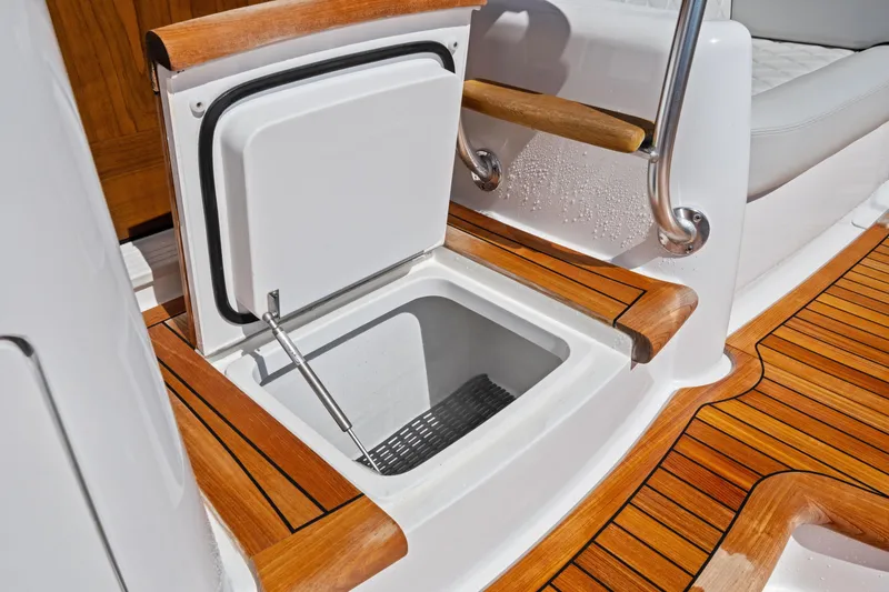 Yacht Photos Pics Open storage compartment on 2025 Viking 64 Convertible yacht with teak flooring.