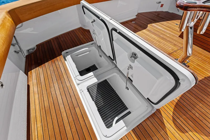  Yacht Photos Pics Open storage compartments on 2025 Viking 64 Convertible yacht with teak deck.