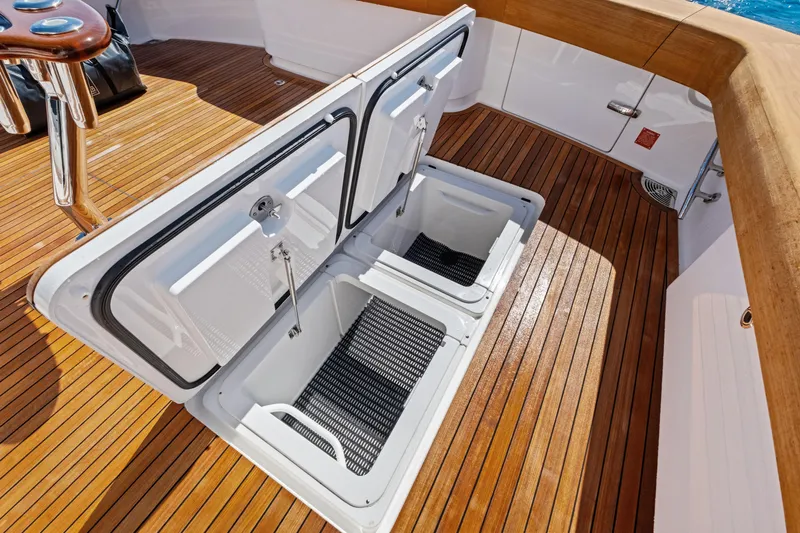  Yacht Photos Pics Open storage compartments on 2025 Viking 64 Convertible yacht's teak deck.