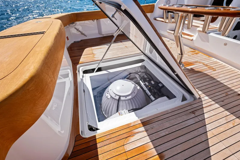  Yacht Photos Pics Open hatch on 2025 Viking 64 Convertible yacht deck, revealing mechanical equipment.