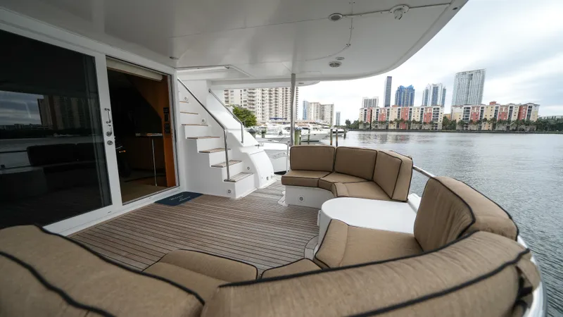 4 Princesses Yacht Photos Pics Luxury deck of 2002 Queenship 70 Baretta yacht with city skyline view.