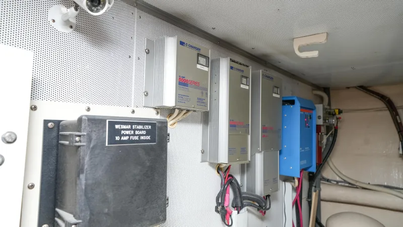 4 Princesses Yacht Photos Pics Electrical panel and stabilizer system inside a 2002 Queenship 70 Baretta yacht.