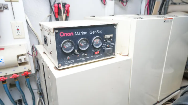 4 Princesses Yacht Photos Pics Onan Marine GenSet in the engine room of a 2002 Queenship 70 Baretta yacht.