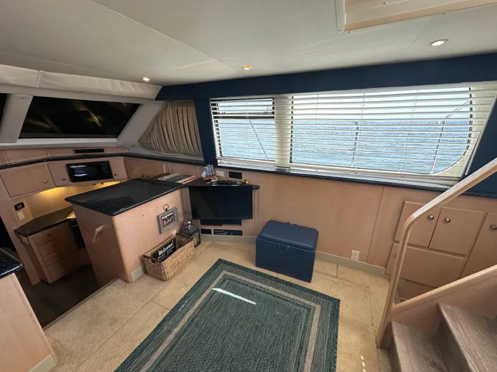  Yacht Photos Pics Interior of 2000 Carver 406 Motor Yacht with kitchen and seating area.