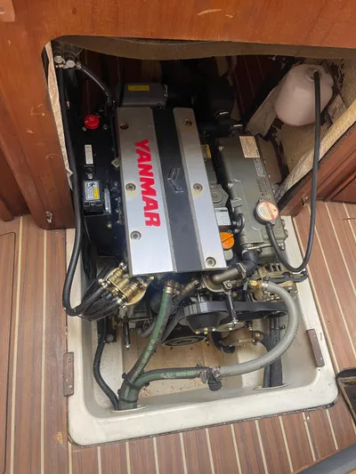 Argo Yacht Photos Pics Yanmar engine in a 2004 Hunter 44 DS Deck Salon sailboat, showing detailed components.