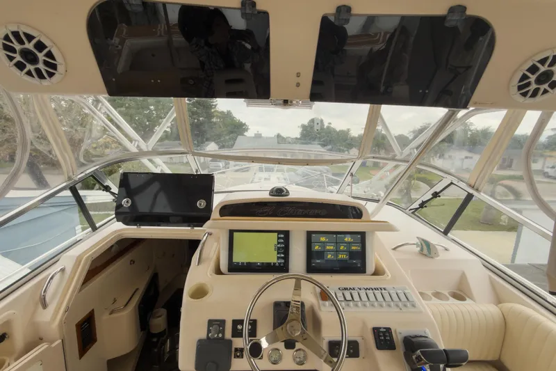  Yacht Photos Pics 2006 Grady-White Express 330 boat cockpit with navigation screens and steering wheel.
