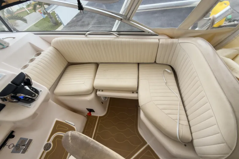  Yacht Photos Pics 2006 Grady-White Express 330 boat interior with beige seating and control panel.
