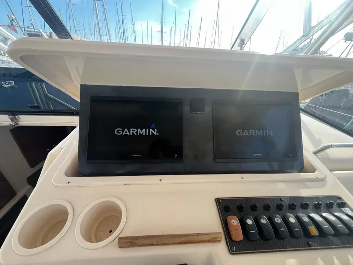  Yacht Photos Pics Dashboard of 2010 Grady-White Express 305 with dual Garmin displays and control panel.