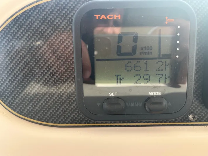 Yacht Photos Pics Close-up of a tachometer on a 2010 Grady-White Express 305 boat dashboard.