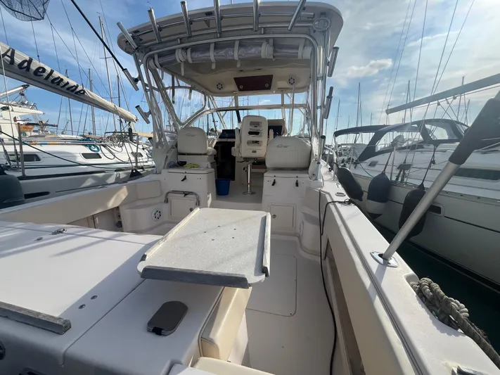  Yacht Photos Pics 2010 Grady-White Express 305 boat interior, docked at marina, clear sky background.