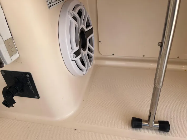  Yacht Photos Pics Interior view of a 2010 Grady-White Express 305 boat, featuring a speaker and metal support.