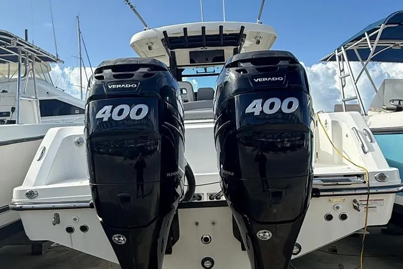  Yacht Photos Pics 2023 Boston Whaler 330 Outrage with twin 400 Verado engines, docked at marina.