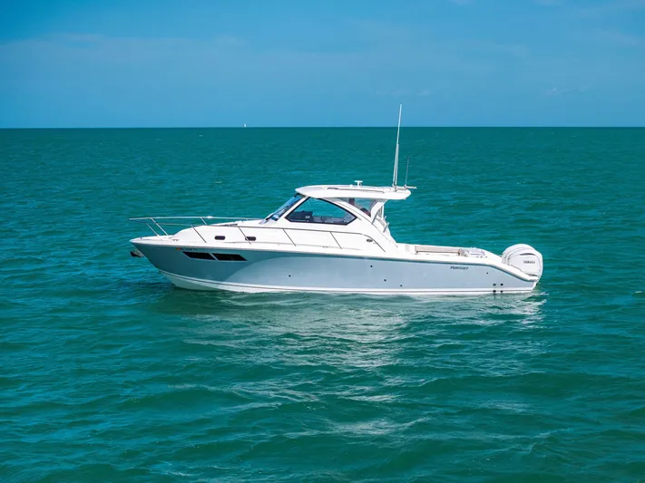 No Name Yacht Photos Pics 2025 Pursuit OS 355 Offshore boat on calm ocean waters under clear blue sky.