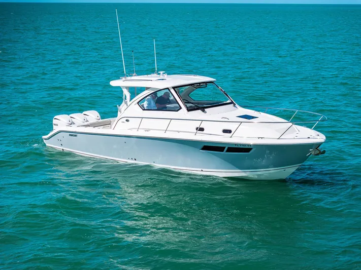 No Name Yacht Photos Pics 2025 Pursuit OS 355 Offshore boat cruising on clear blue water.