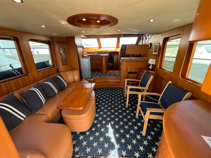 Apaiser Yacht Photos Pics Luxurious interior of 2005 Ocean Alexander 52 Sedan yacht with elegant seating and star-patterned carpet.