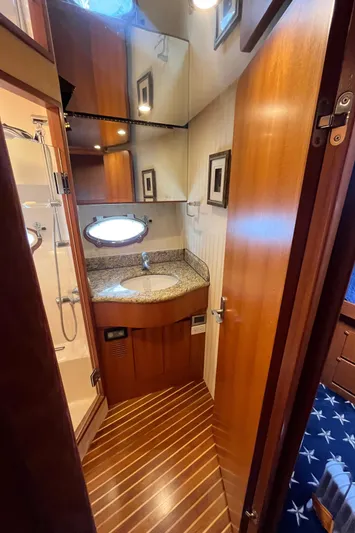 Apaiser Yacht Photos Pics 2005 Ocean Alexander 52 Sedan bathroom with wood accents and modern fixtures.