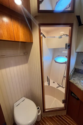 Apaiser Yacht Photos Pics Bathroom interior of 2005 Ocean Alexander 52 Sedan yacht with shower and toilet.
